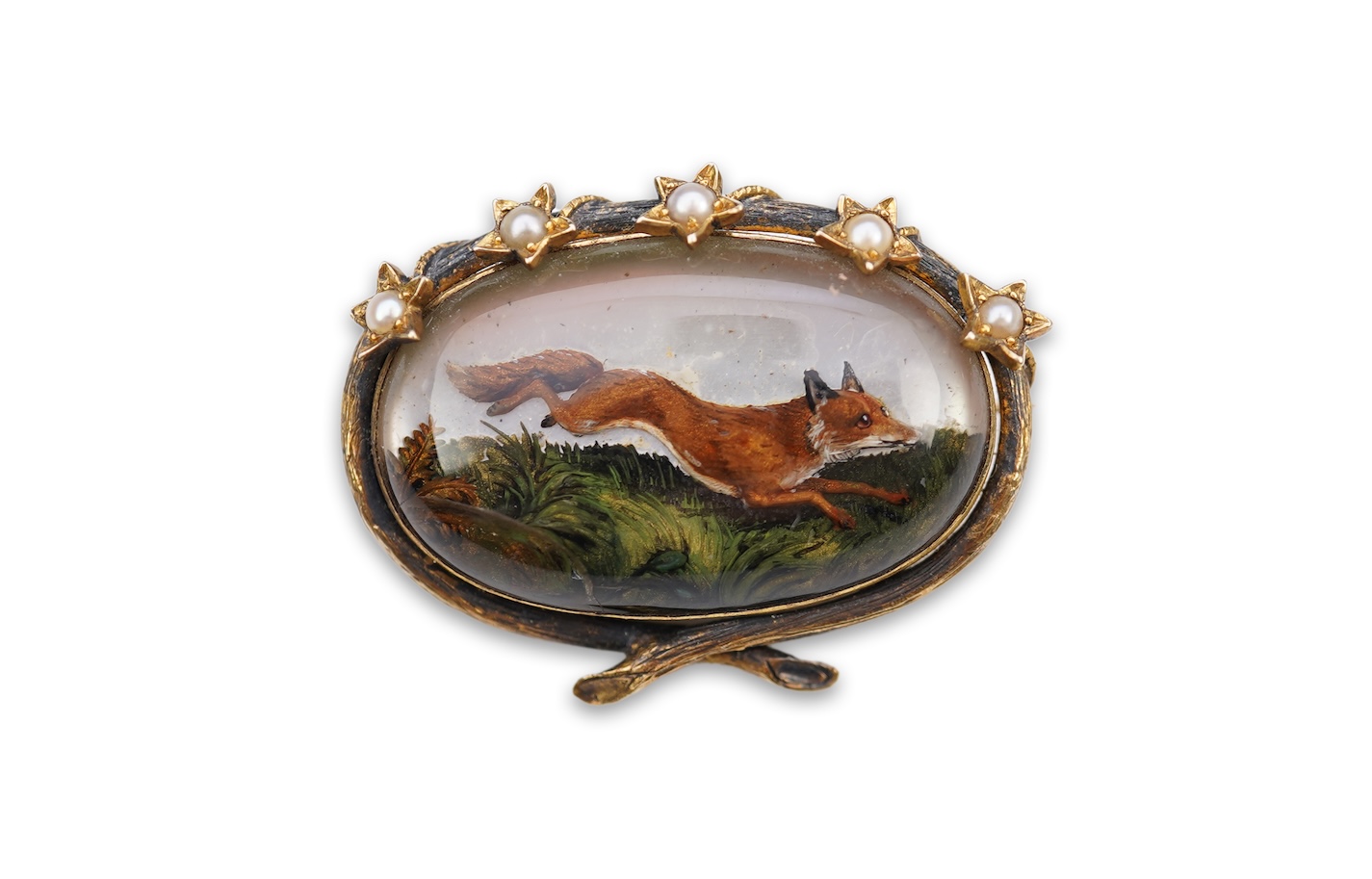 A reverse-carved and painted intaglio 'Essex crystal' brooch, late 19th century